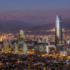 panorama of Santiago (Providencia buildings and the Gran Torre Santiago tower) and Andes Mountains, Santiago, Chile.